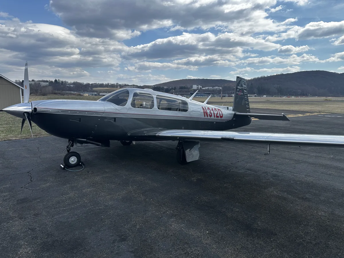 A Mooney Ovation (N312D) on the ramp