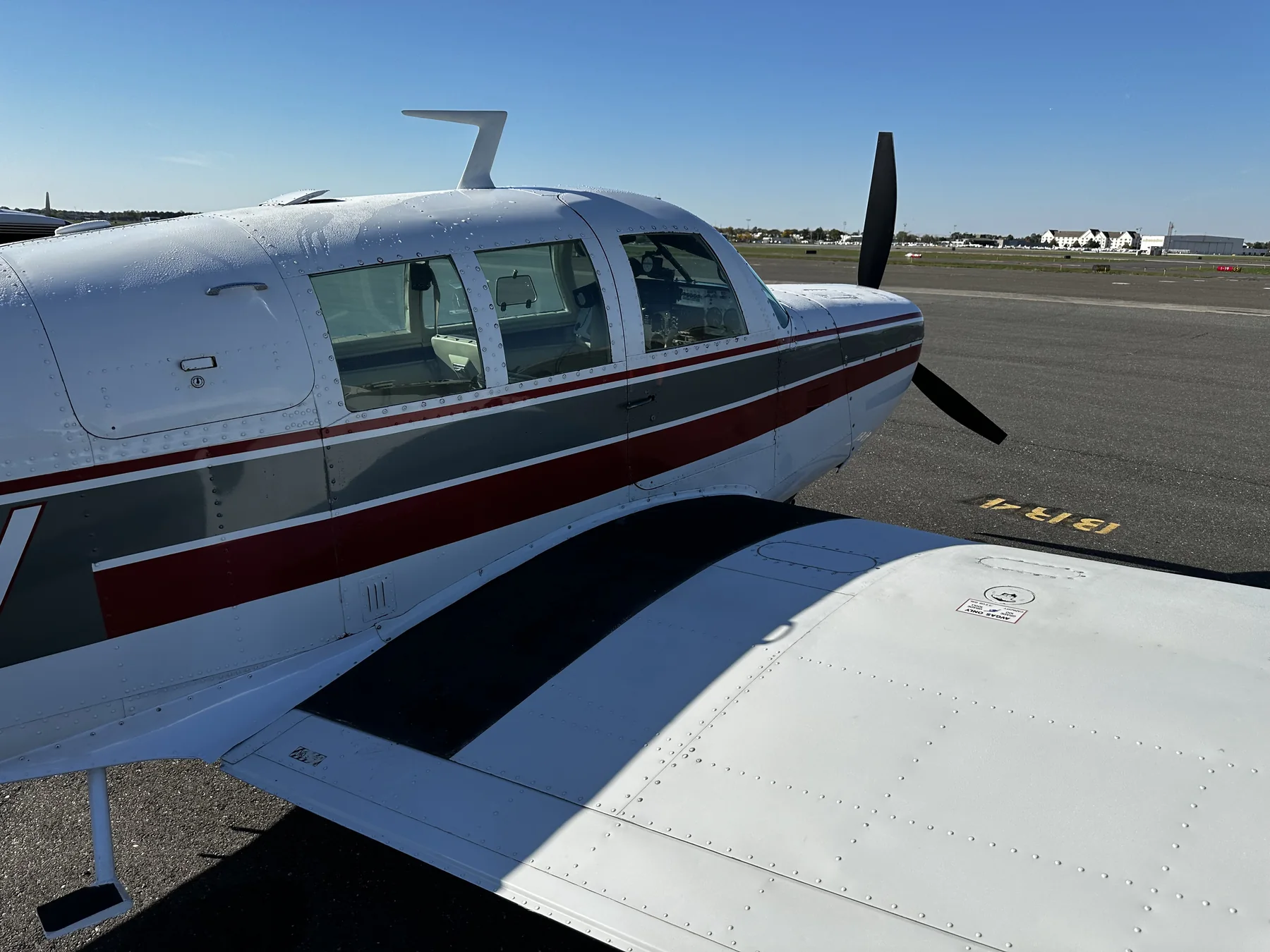 N9363V cabin windows and wing root in sunlight